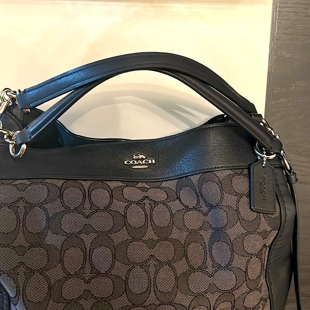 Black coach bag with logo